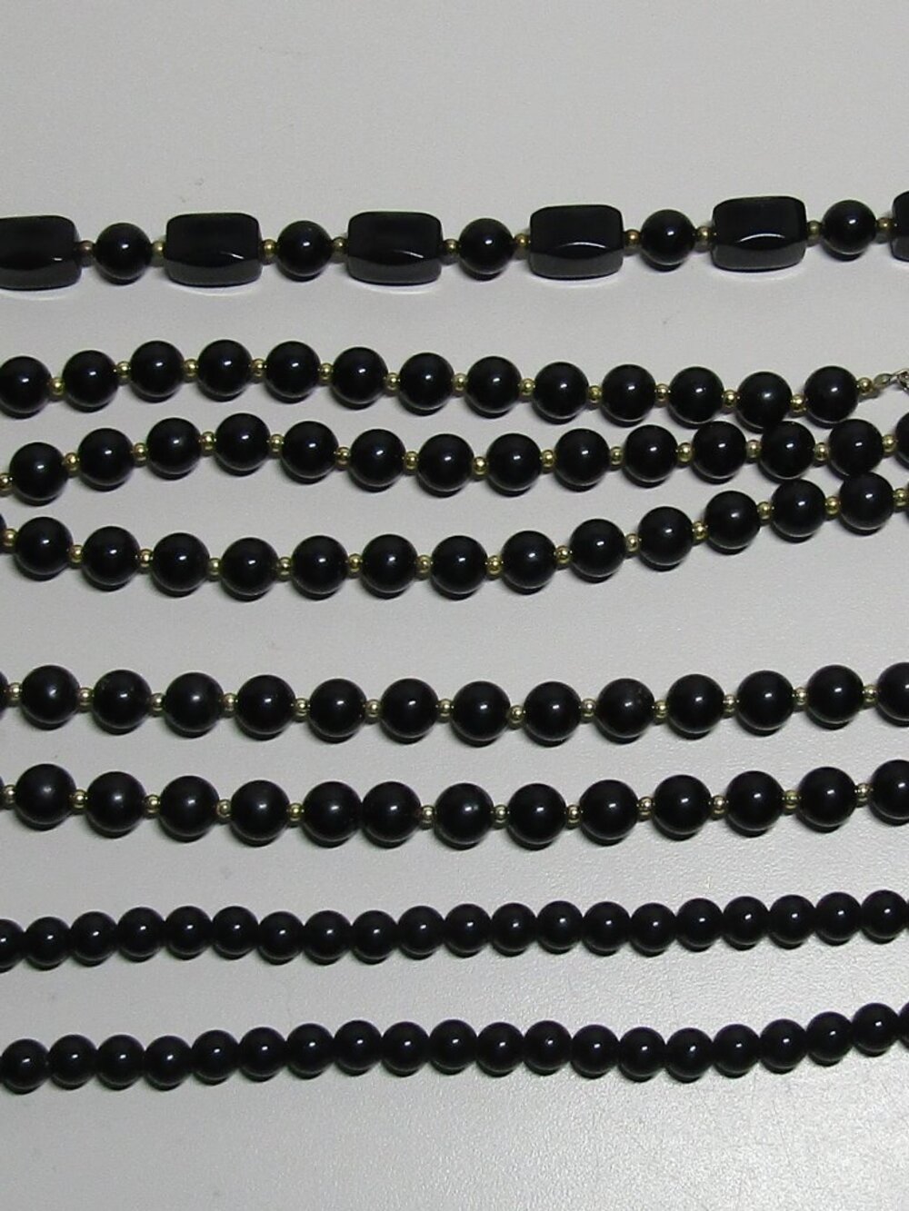Lot of 4 necklaces of black beads assorted sizes and styles estate find